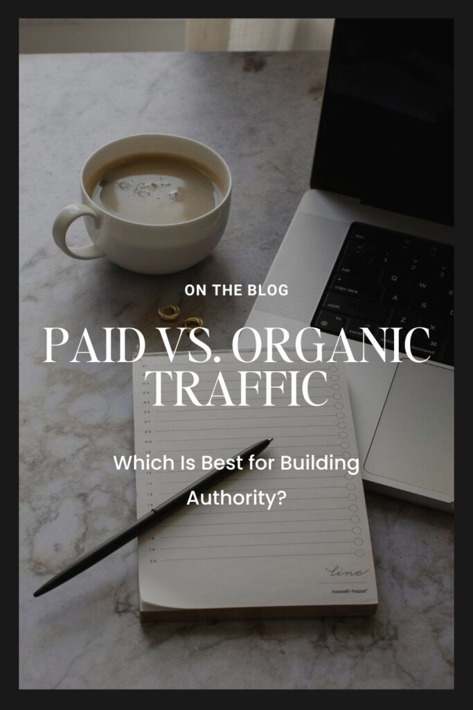 Image of a cup of coffee next to a laptop and a notepad with a pen on a marble surface with text overlay 'On the Blog: Paid vs. Organic Traffic - Which Is Best for Building Authority?'