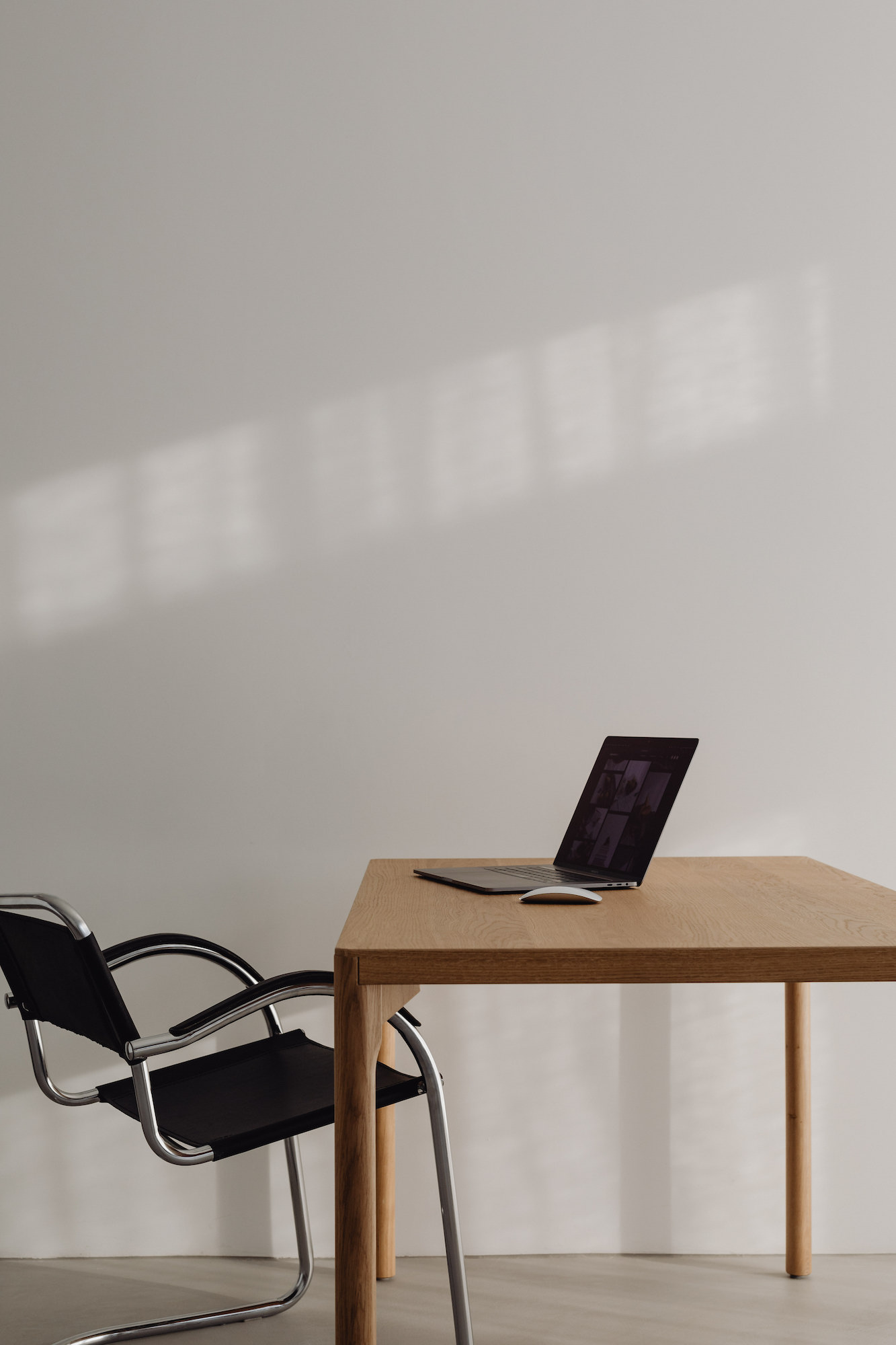 Empty seat at a minimal wooden computer desk