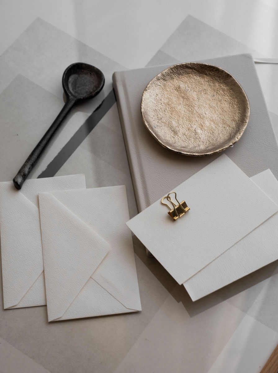 Flatlayy of stationary, color schemes and a book